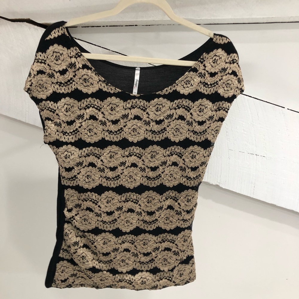 Black and gold patterned women’s top